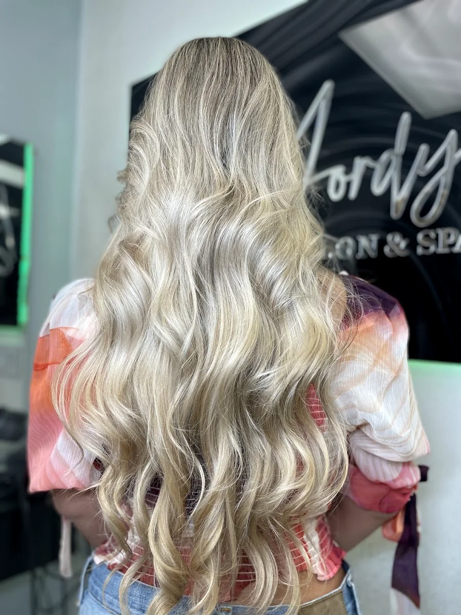 Long blonde waves with a soft balayage melt