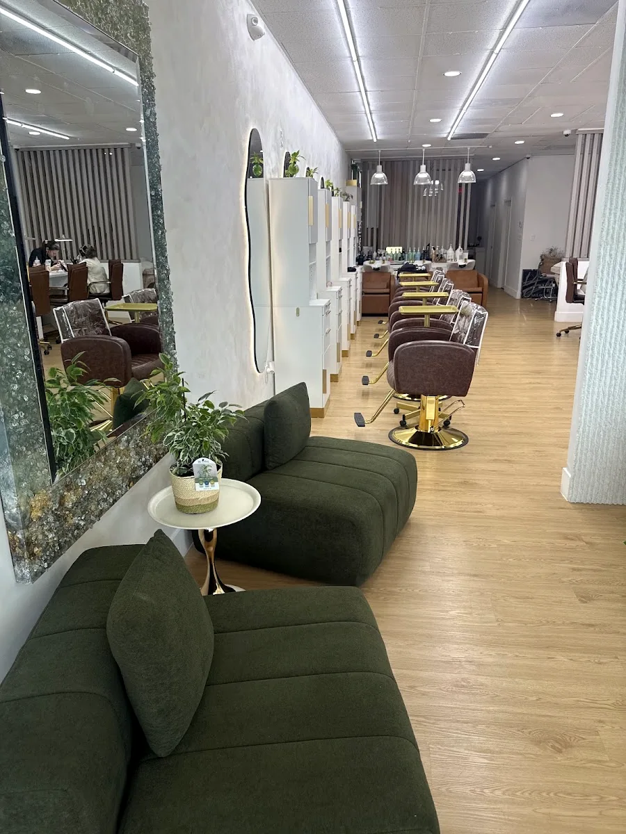 Styling row at By Yordy with olive velvet seating and brass mirrors